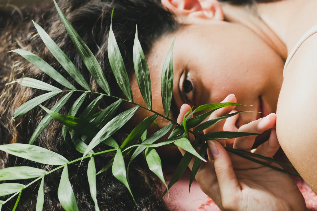 young brunette with leaves looking camera.jpg 2222